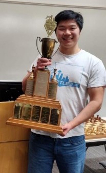 Samuel He with trophy